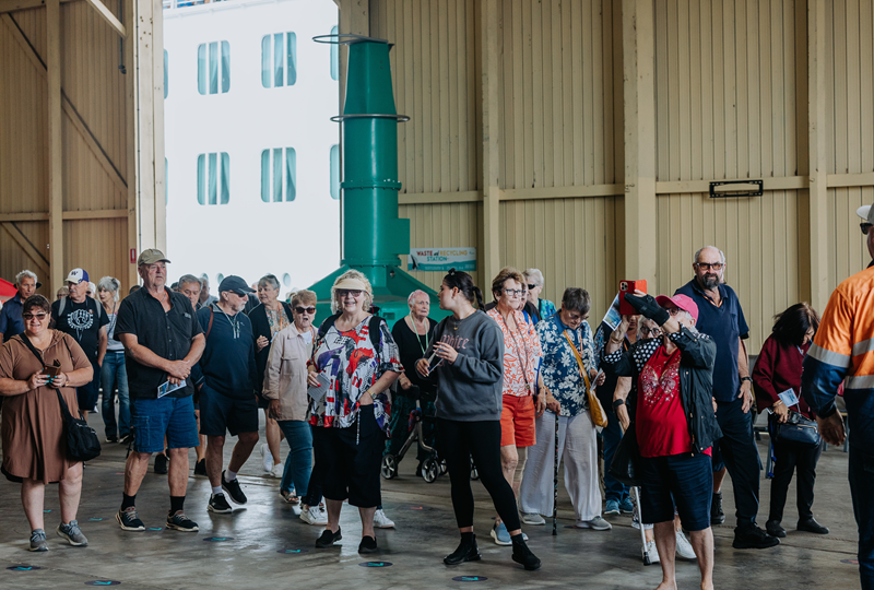 Cruise passengers in transit shed
