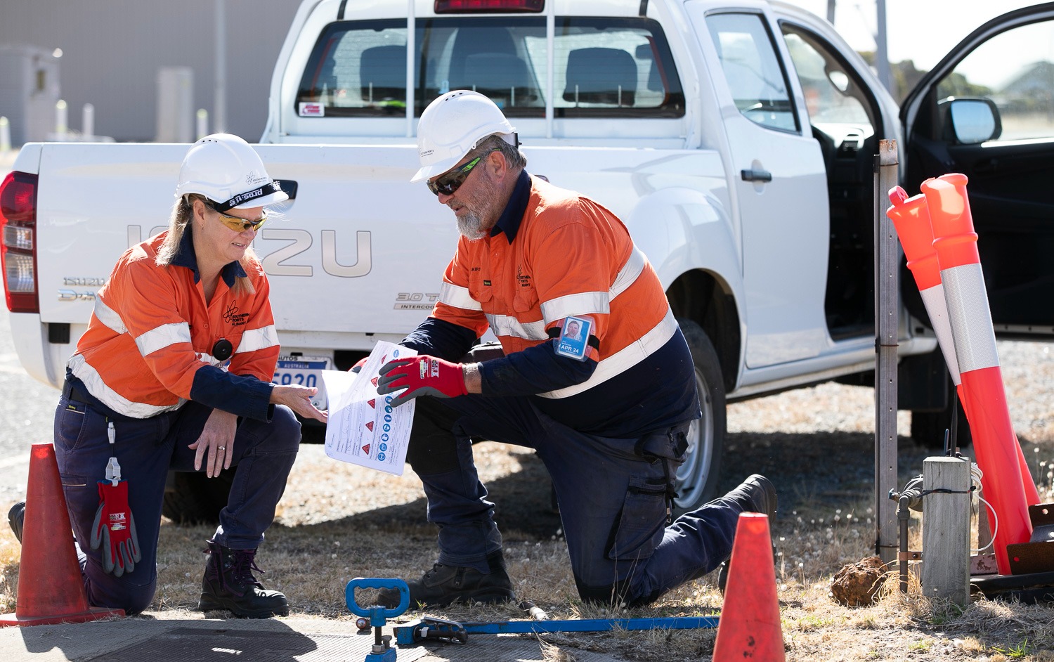Safety and maintenance representatives with safety paperwork
