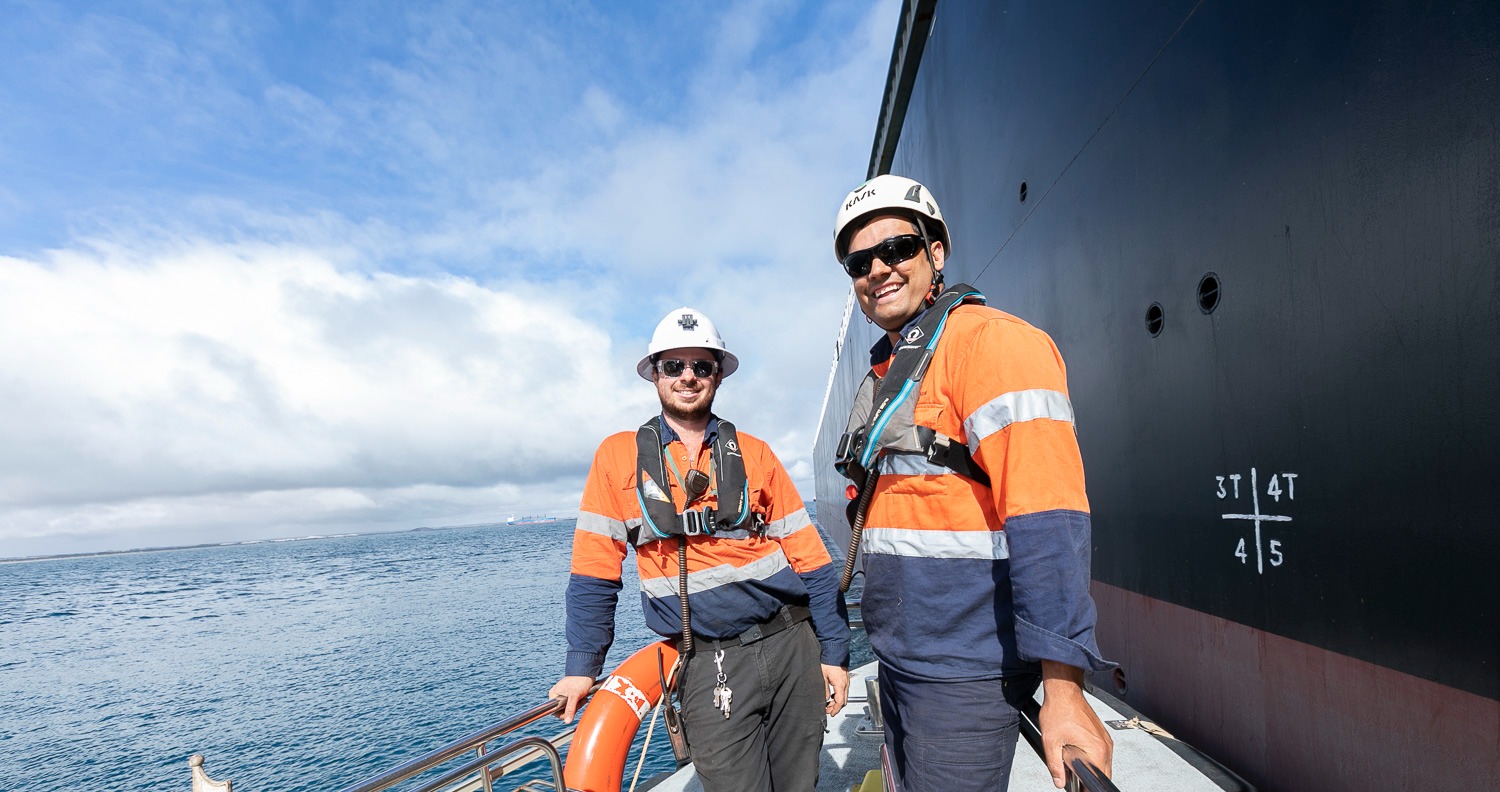 Coxswain and deckhand on a pilot boat alongside a vessel