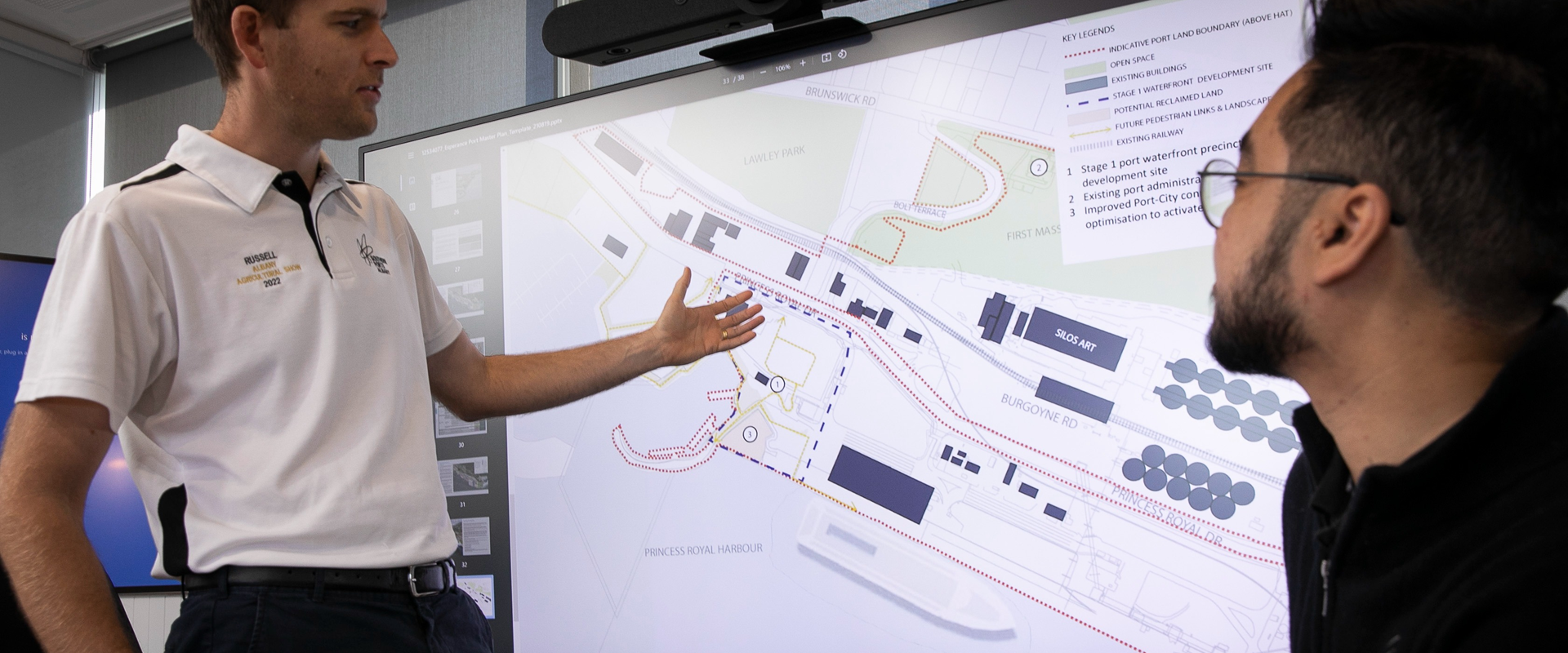 People reviewing plan of port