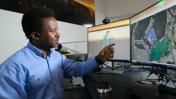 Southern Ports staff member looking at interactive map