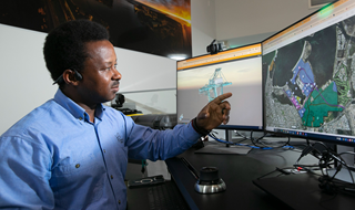 Southern Ports staff member looking at interactive map