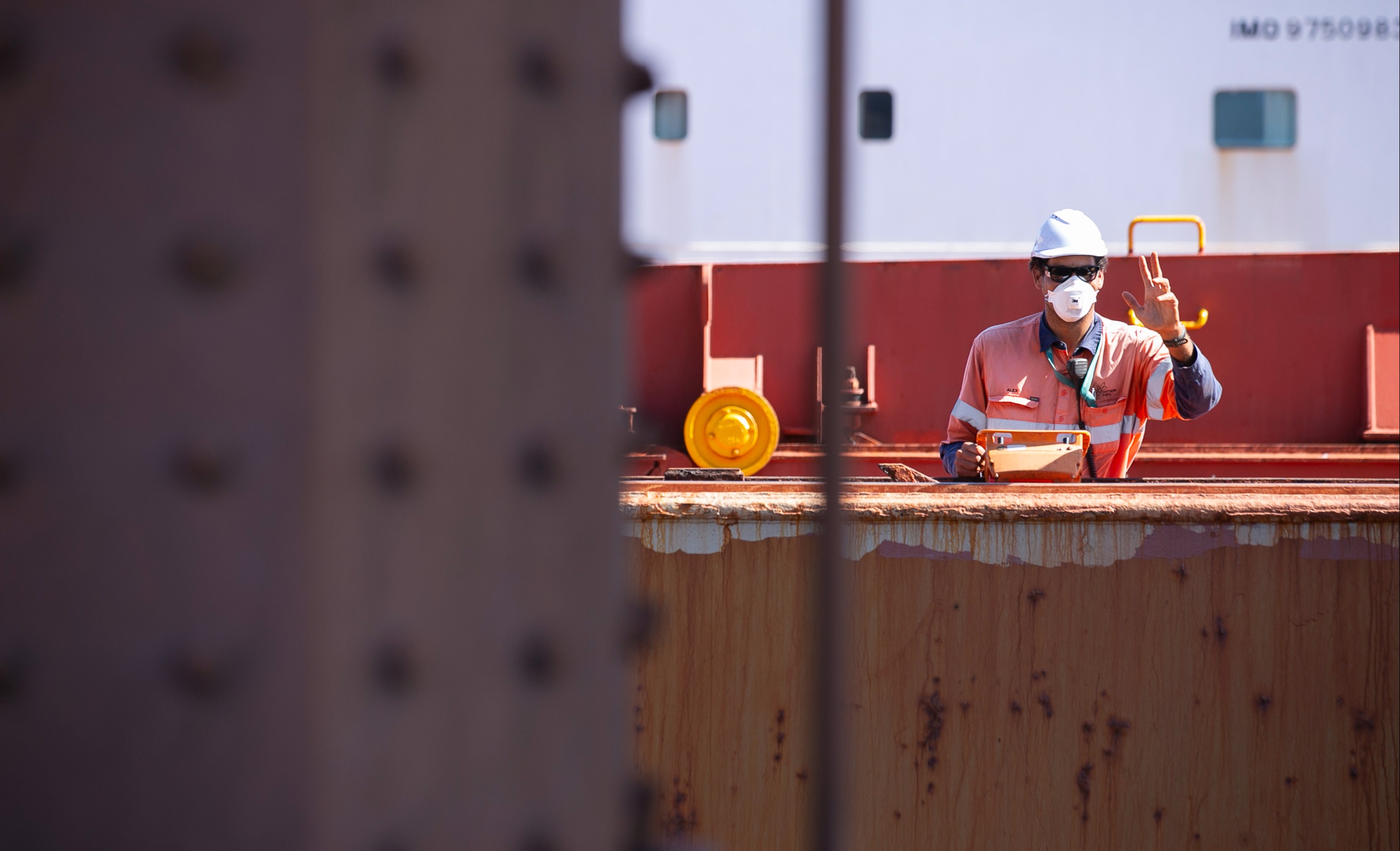 Hatchman working on iron ore loading