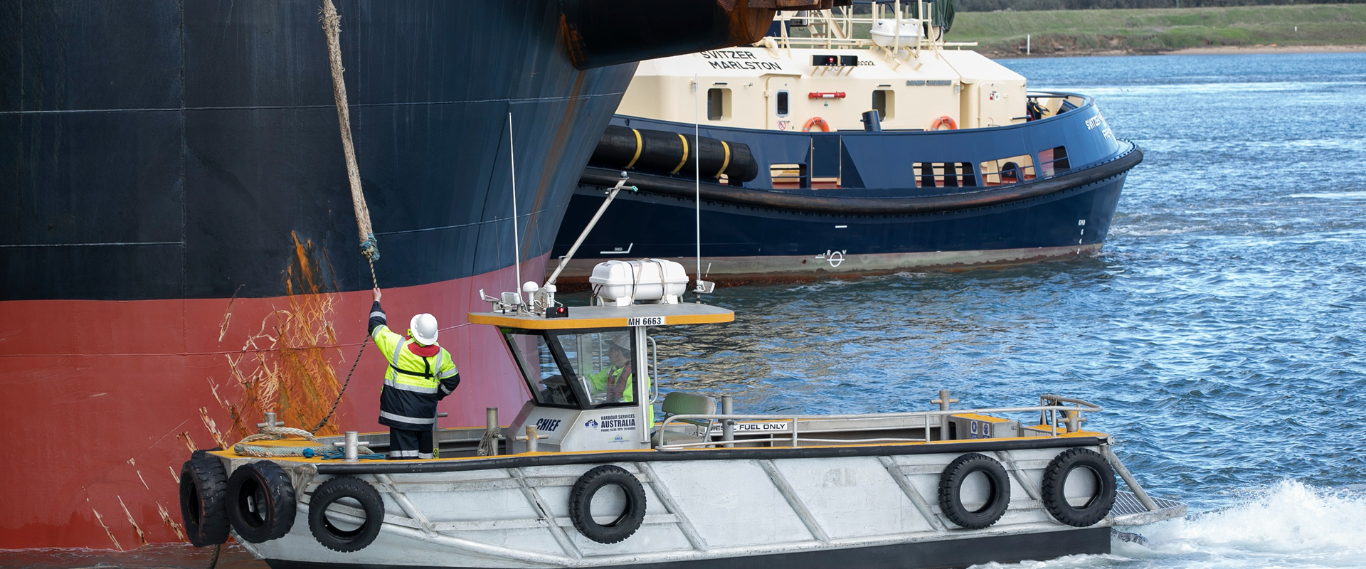 Lines boat alongside vessel
