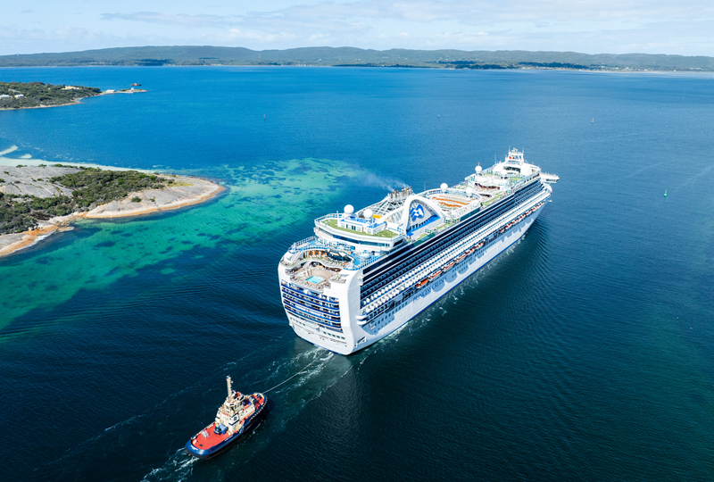 Cruise ship entering Princess Royal Harbour with tug boat